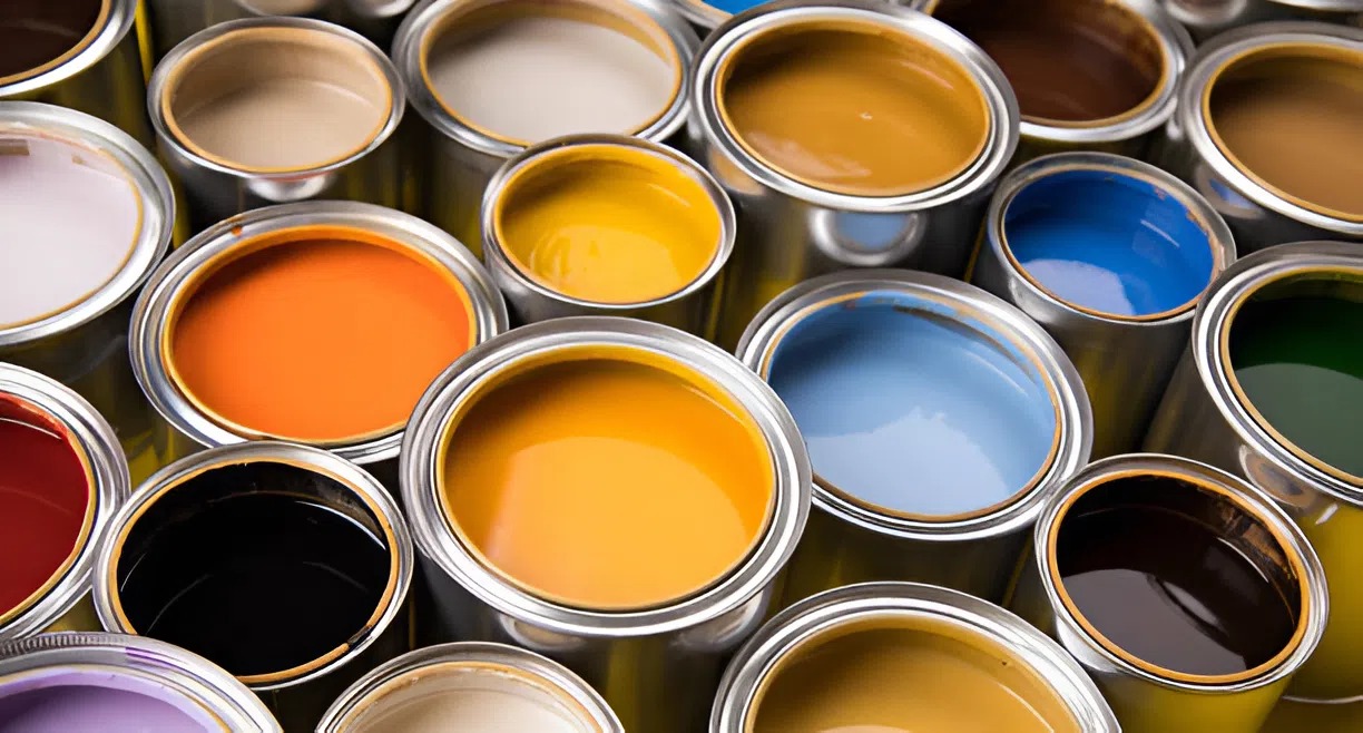 Assorted open paint cans showing trendy commercial color palettes used by painters in Nashville, TN