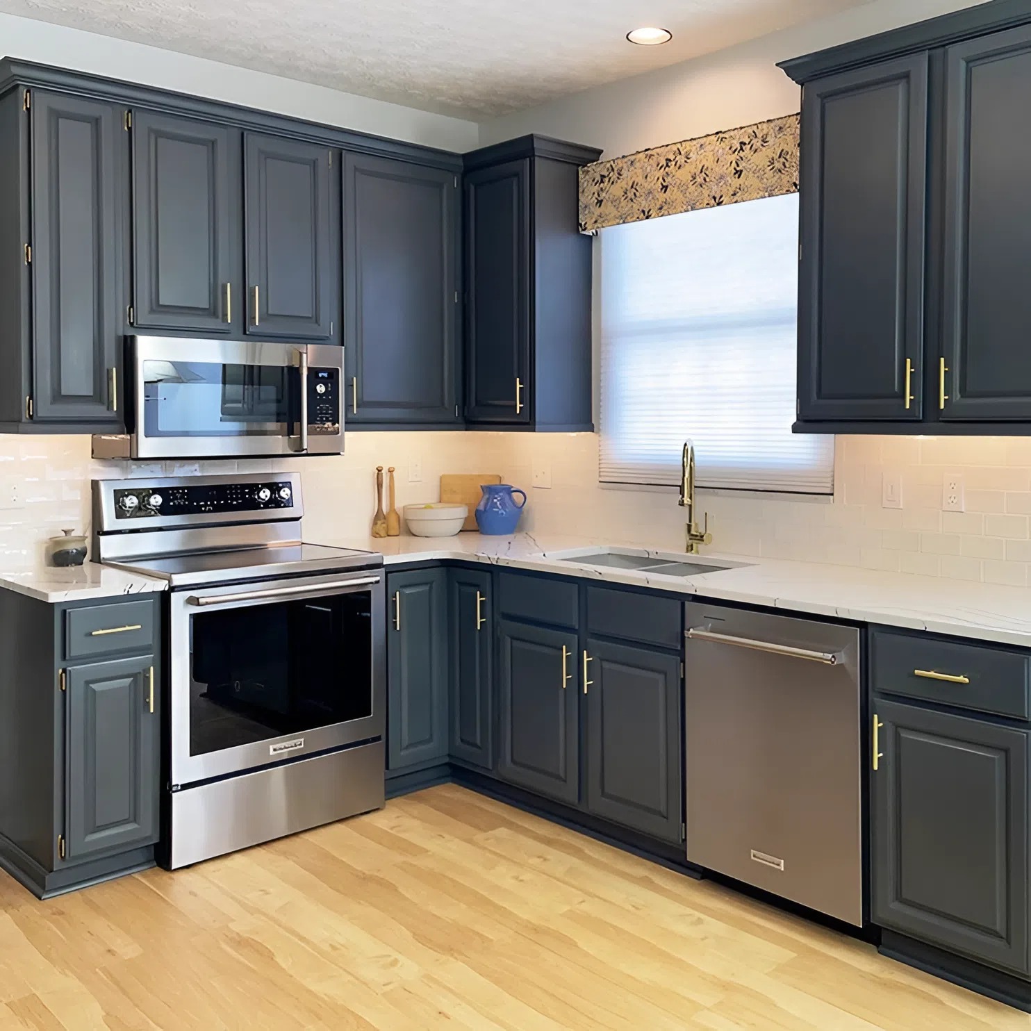Navy blue painted kitchen cabinets with a clean, modern finish by a professional cabinet painter in College Grove, TN