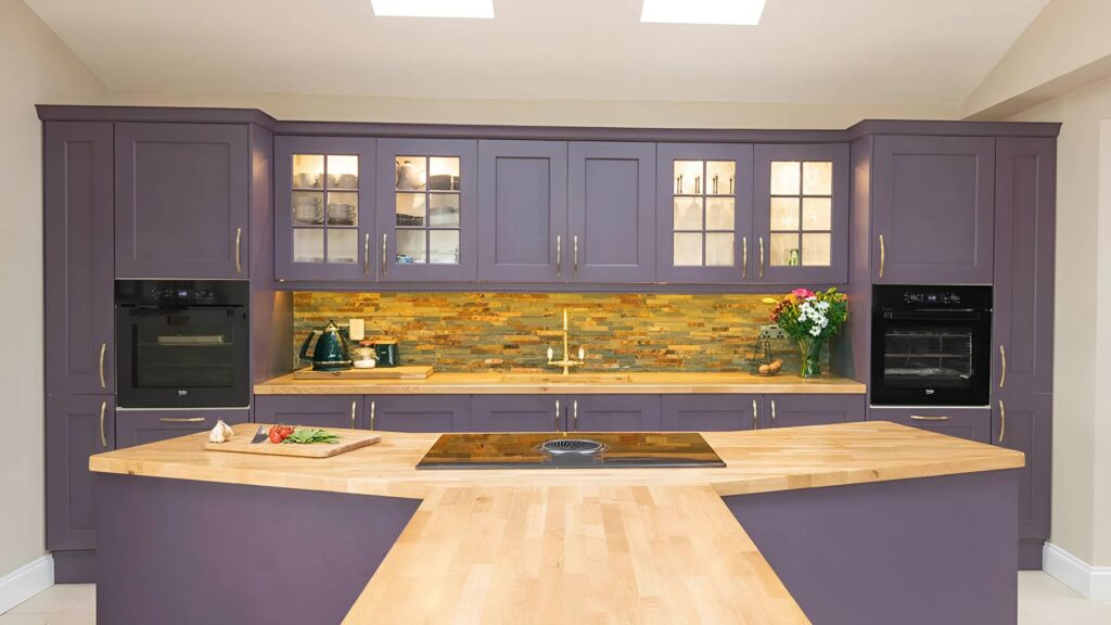 Purple painted kitchen cabinets with a sleek, modern finish by a cabinet painting professional in College Grove, TN