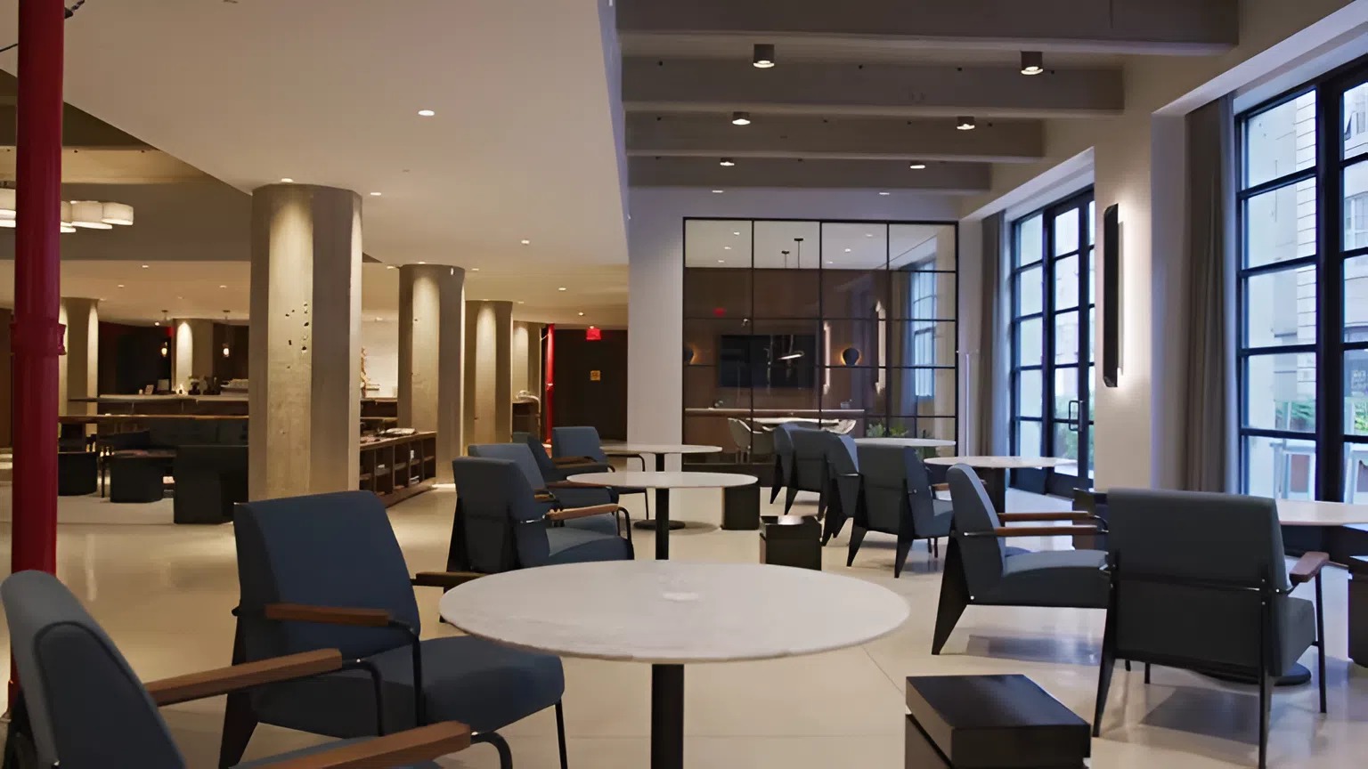 Formal space with warm white walls, soft gray columns, and charcoal accents by an interior painter in Franklin, TN